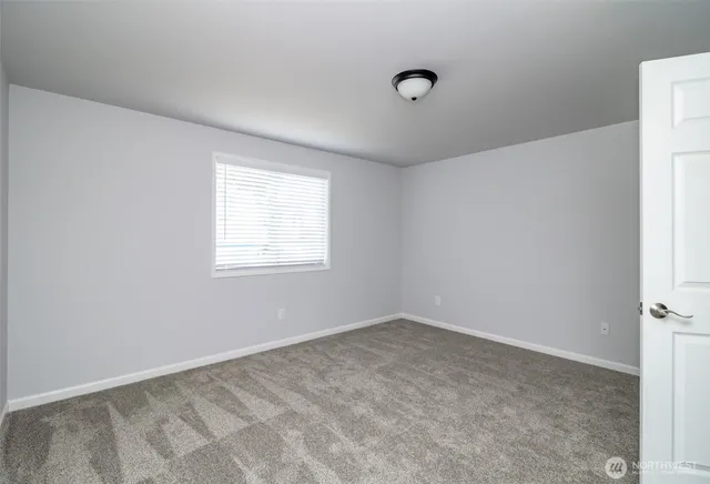 a view of a room that has a window in it