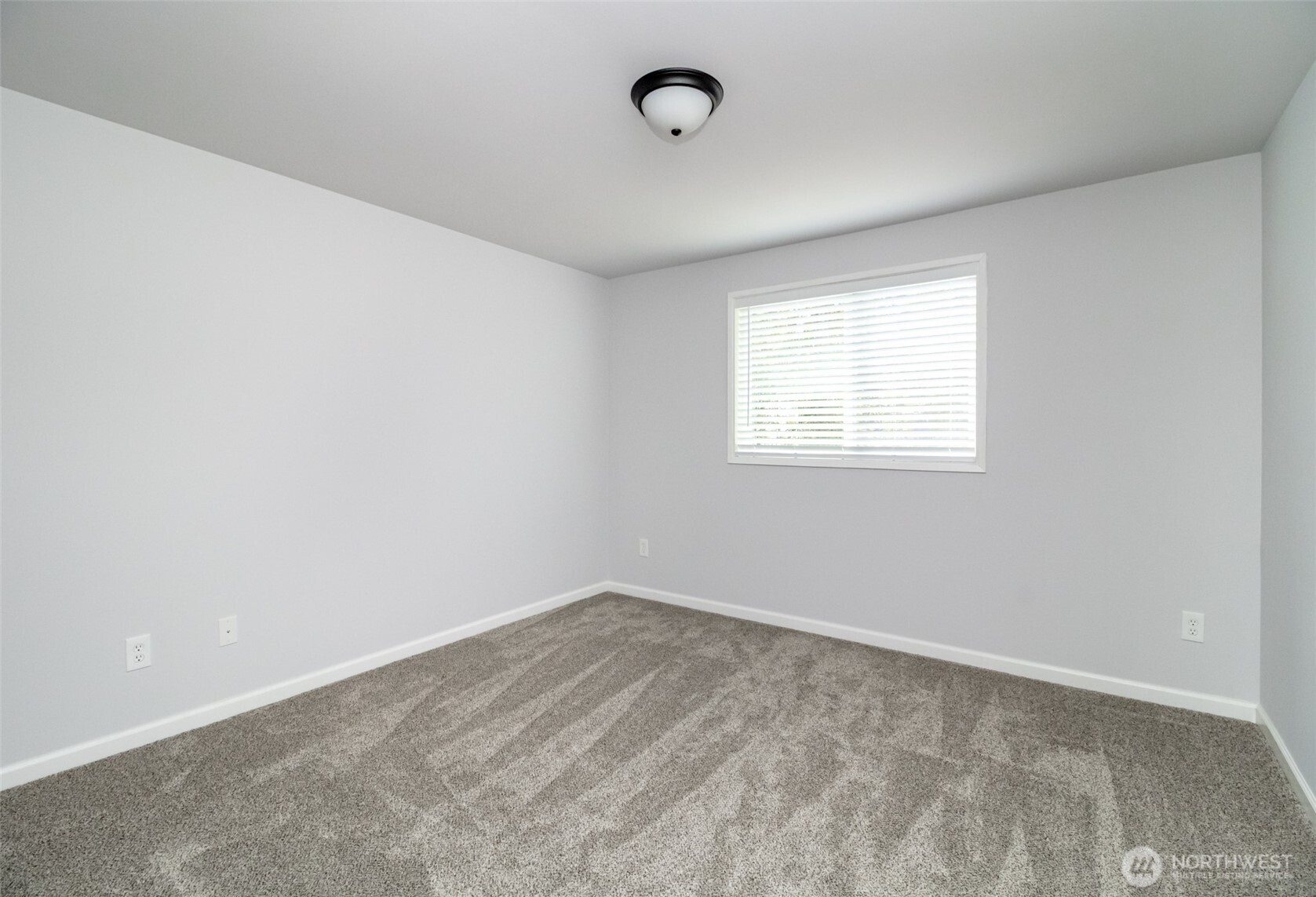 5823 186th Ave Court East, Unit A Lake Tapps, WA 98391 - Photo 22 of 27 an empty room with a window