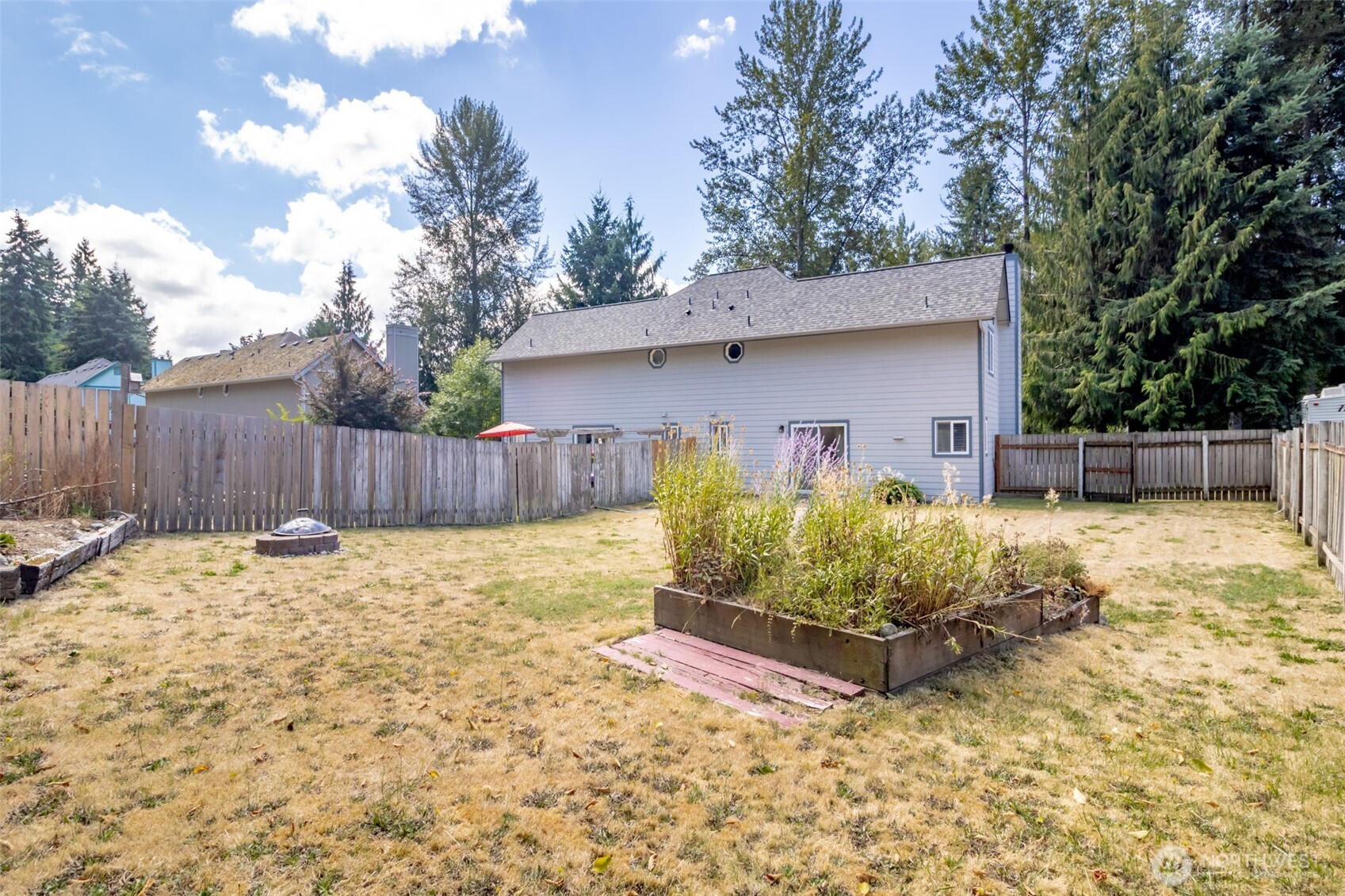 5823 186th Ave Court East, Unit A Lake Tapps, WA 98391 - Photo 27 of 27 a backyard of a house