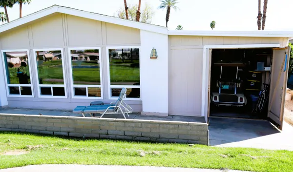 a view of a swimming pool with a patio