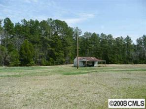 5128 Tabernacle Road Lancaster, SC 29720 - Photo 5 of 8 a view of a grassy area with trees and grass