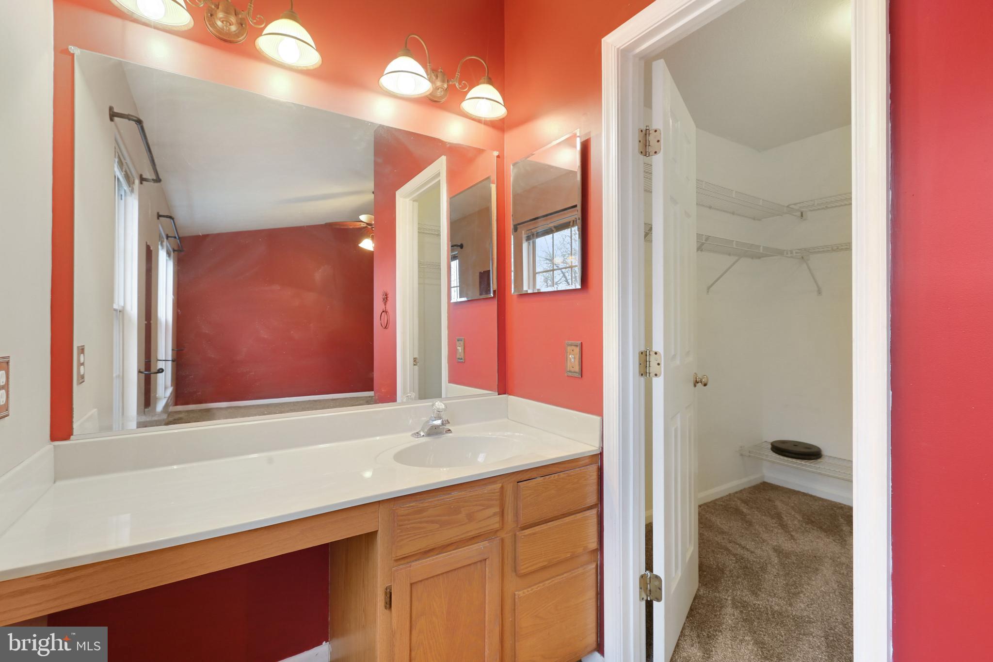 5306 Kelmscot Road Baltimore, MD 21237 - Photo 18 of 35 Primary Bedroom Vanity & Walk-In Closet