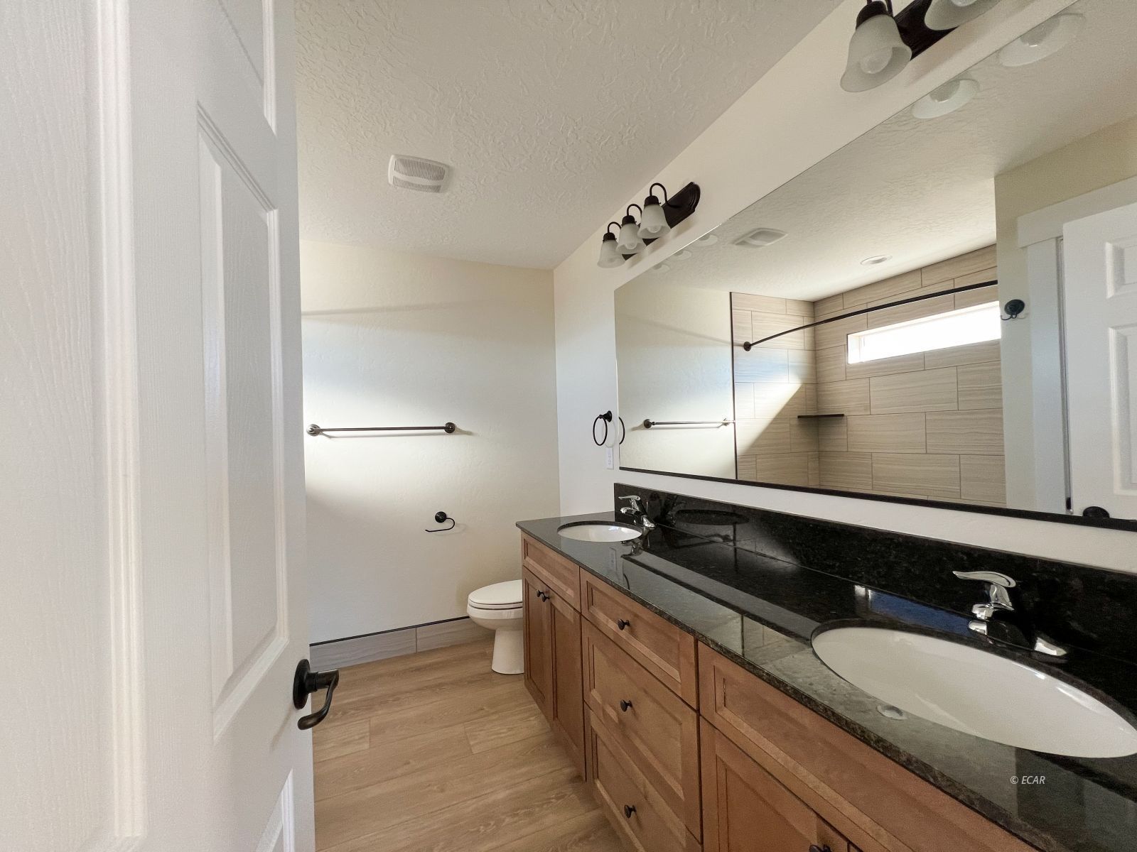 410 Ridgeway Drive Spring Creek, NV 89815 - Photo 16 of 26 a bathroom with a sink and a mirror