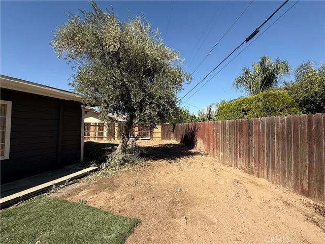 a view of a backyard of the house
