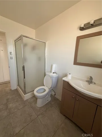 a bathroom with a toilet sink and shower