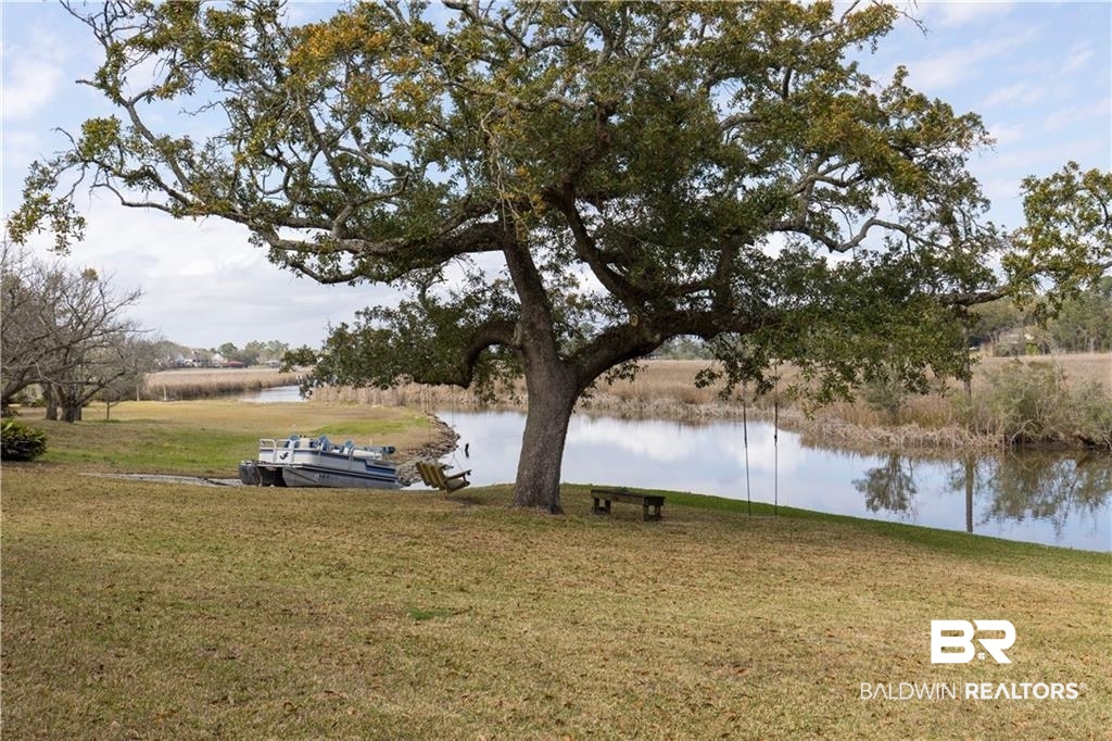 2730 Gator Road Mobile, AL 36605 - Photo 33 of 42 View of green lawn featuring a water view