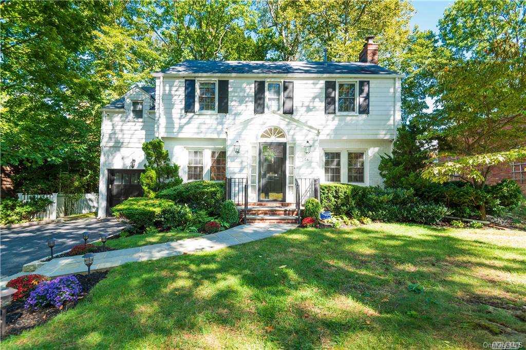 38 Cary Road Great Neck, NY 11021 - Photo 1 of 1 a front view of a house with a yard