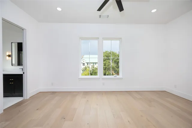a view of livingroom with hardwood floor and ceiling fan