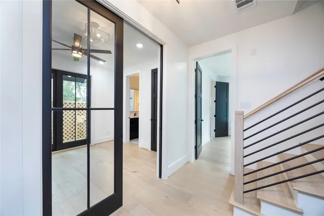 a view of a livingroom with a ceiling fan and window