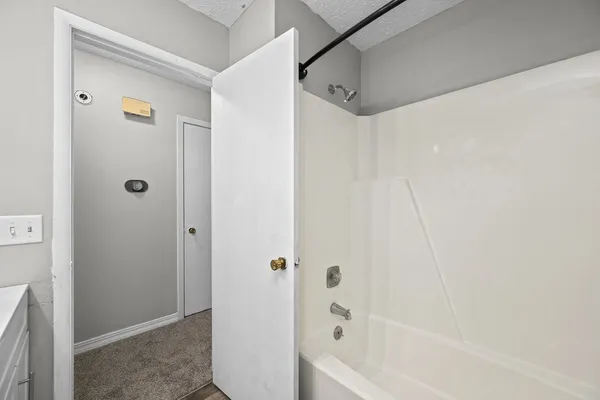 a view of room with a ceiling fan