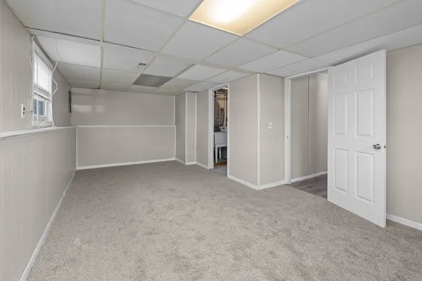 a view of empty room with windows