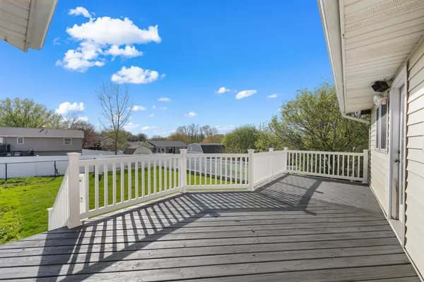 a view of a balcony with wooden floor