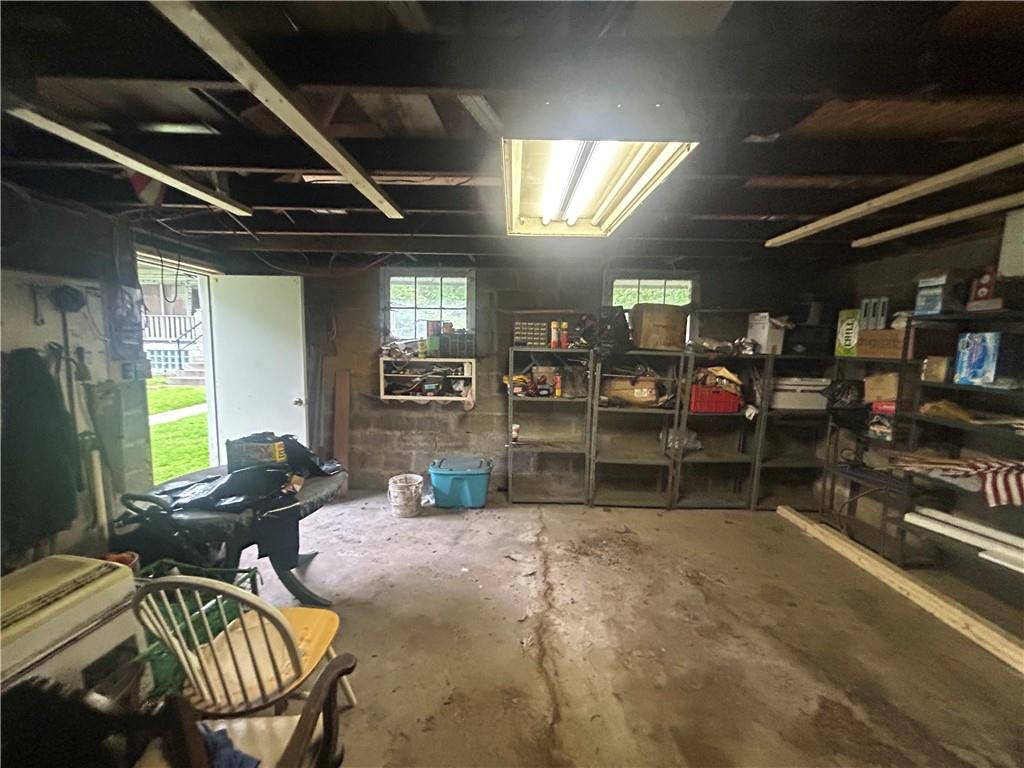 108 Leneake Street Turtle Creek, PA 15145 - Photo 18 of 23 a room with lots of furniture and a rug