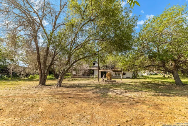 a view of swimming pool with a backyard