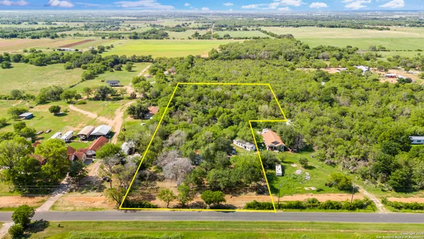 a view of a yard with an outdoor space