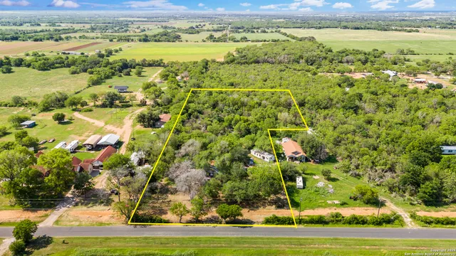 a view of a yard with an outdoor space