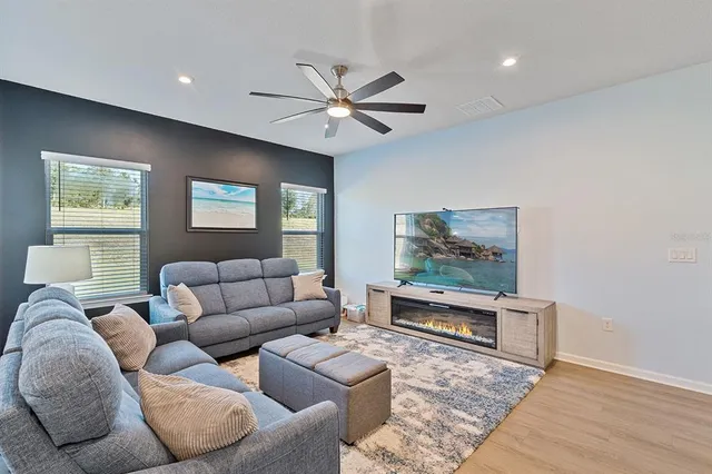 a living room with furniture and a window