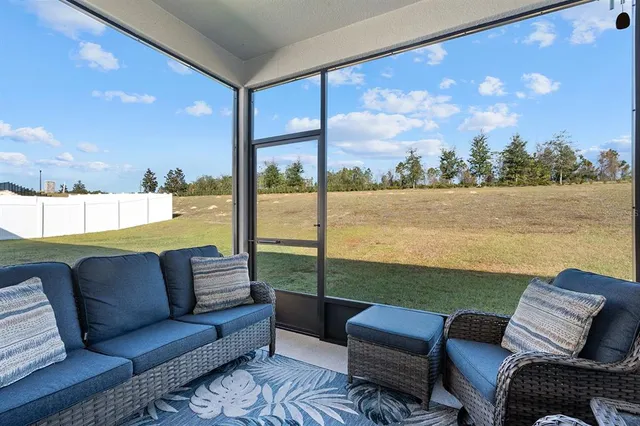 a roof deck with a table and chairs