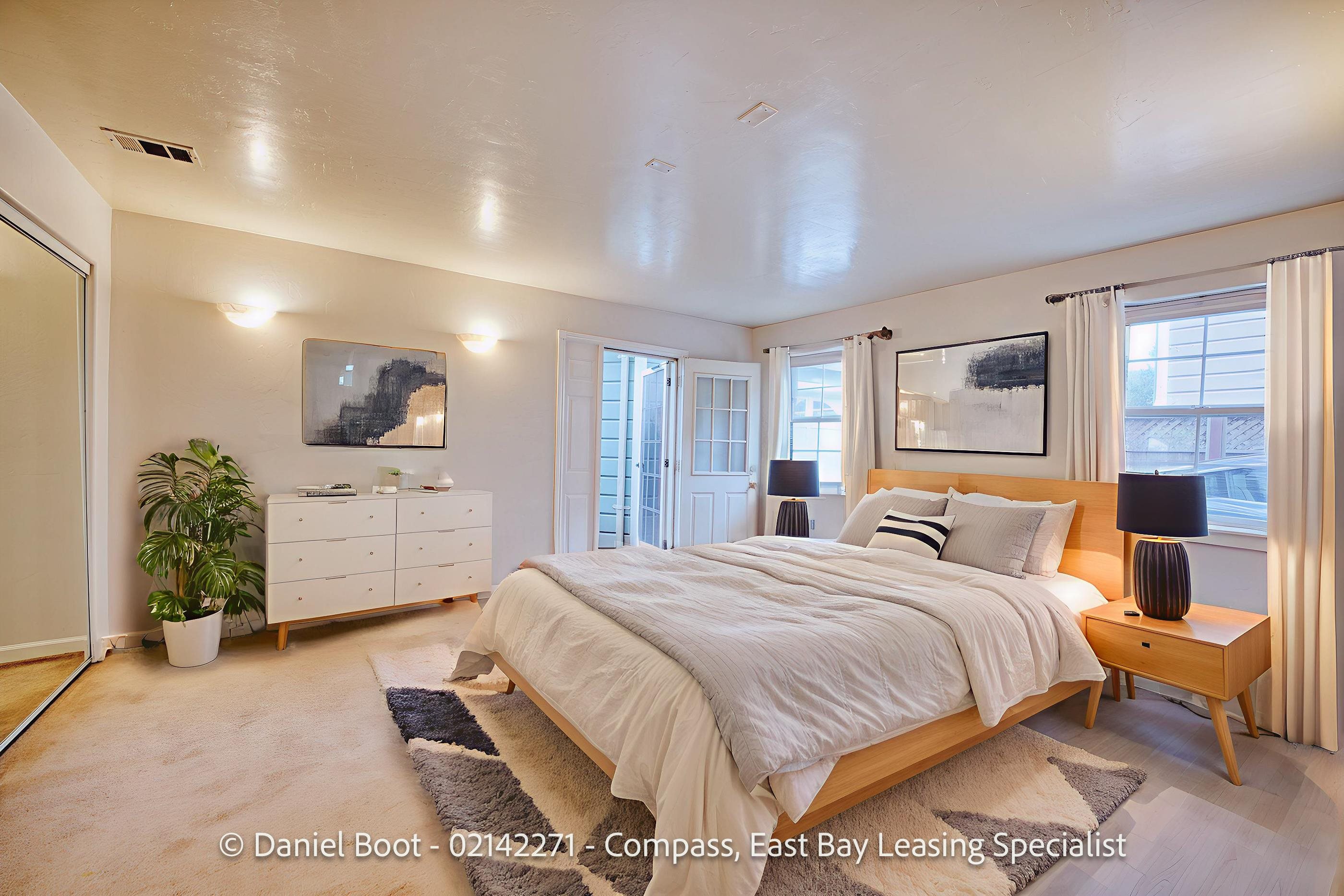 2141 Ward Street Berkeley, CA 94705 - Photo 13 of 41 a spacious bedroom with a large bed and a flat screen tv