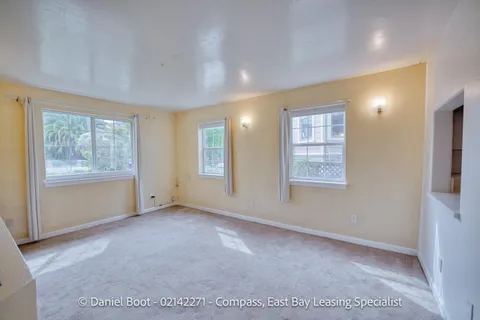 a view of an empty room with windows