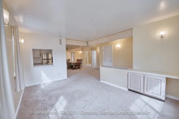 a view of a big room with closet and windows