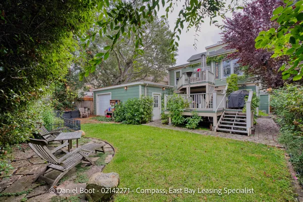 a view of a house with a yard porch and sitting area