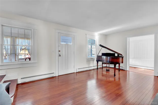 a view of a livingroom with furniture and a workspace