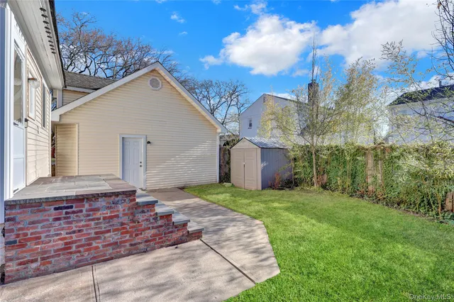 a backyard of a house with lots of green space
