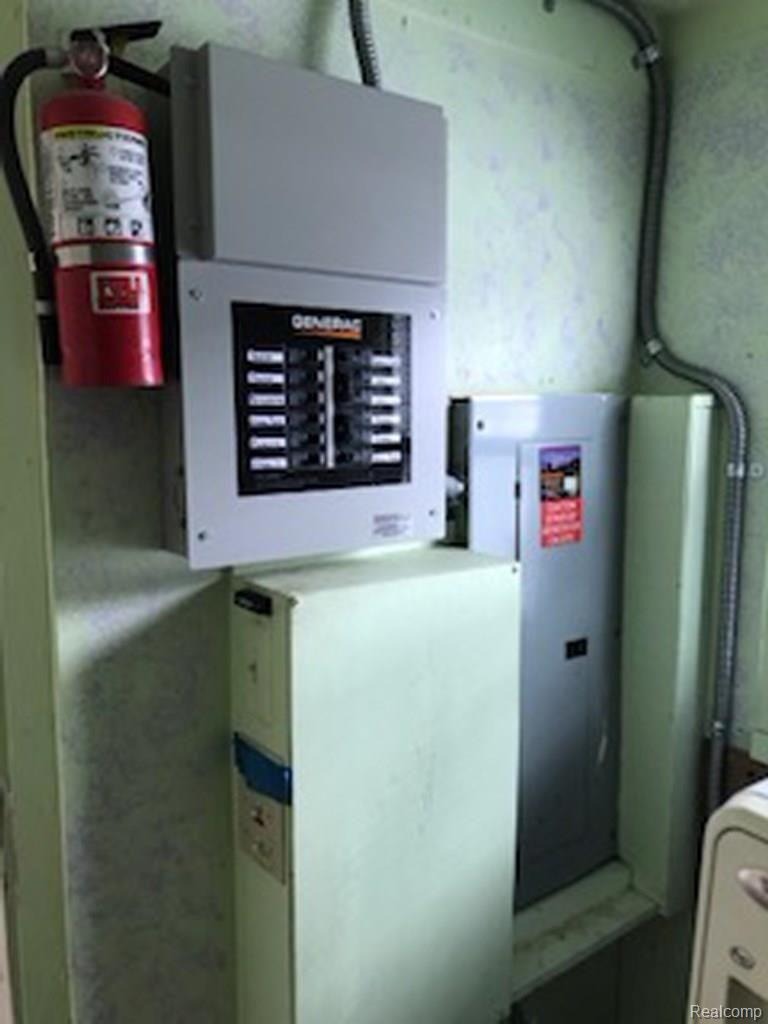 4685 Ketchum Road St. Clair, MI 48079 - Photo 11 of 14 4685 Ketchum generator control panel and breakers.JPG