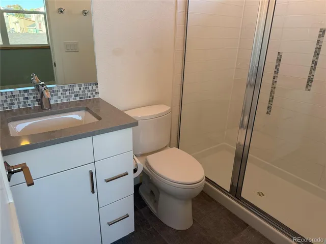 a bathroom with a sink and toilet