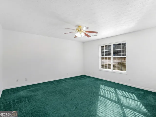 a view of a small space with a fan