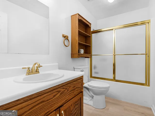 a view of a wooden deck with a yard