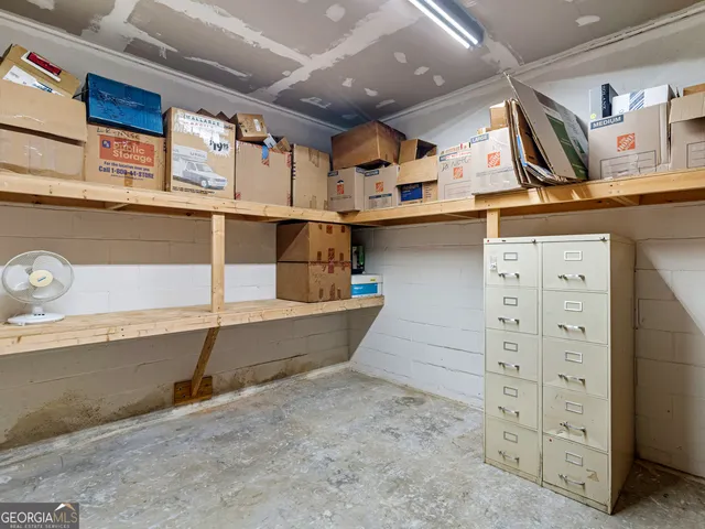 a large house with a big yard and large trees