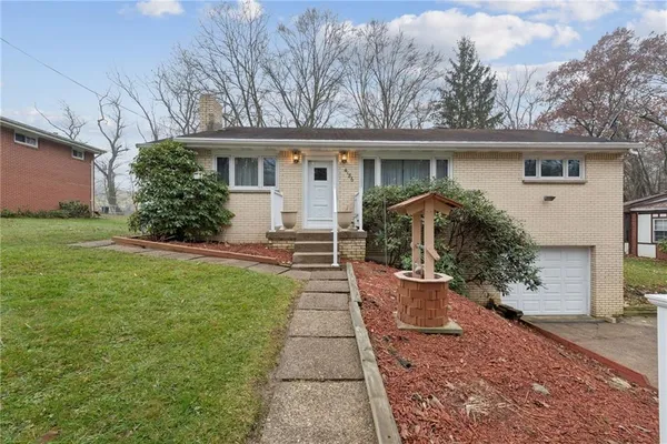 a view of a house with a back yard