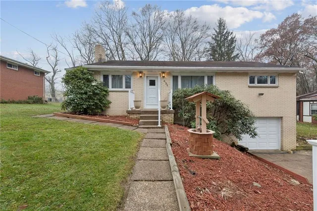 a view of a house with a back yard