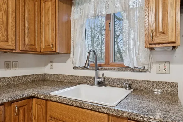 a kitchen with a sink and a window