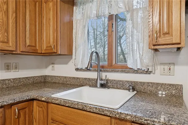 a kitchen with a sink and a window