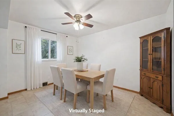 a view of a dining room with furniture and chandelier