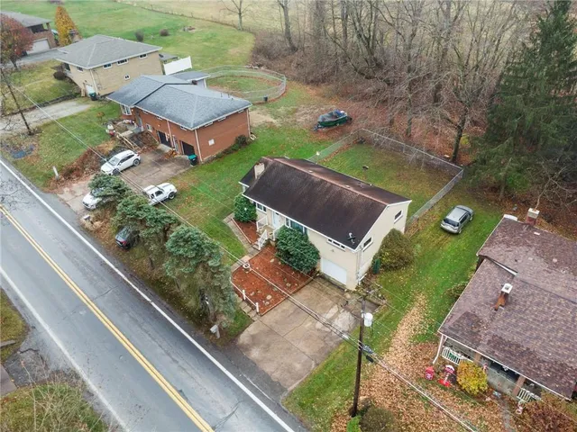 an aerial view of a house with a garden