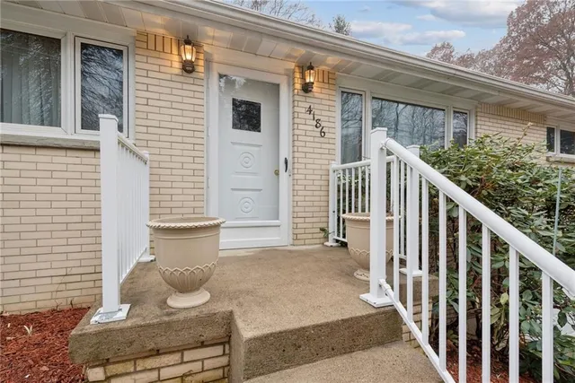 a view of house with wooden floor and a potted plant