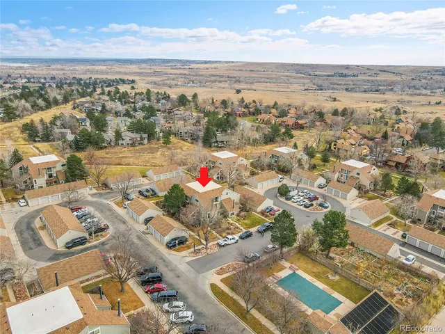 an aerial view of residential houses with outdoor space