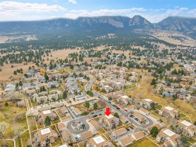 a view of a city with mountains in the background