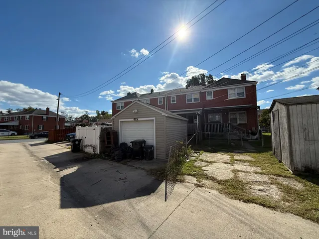 a view of a house with a snow in the yard