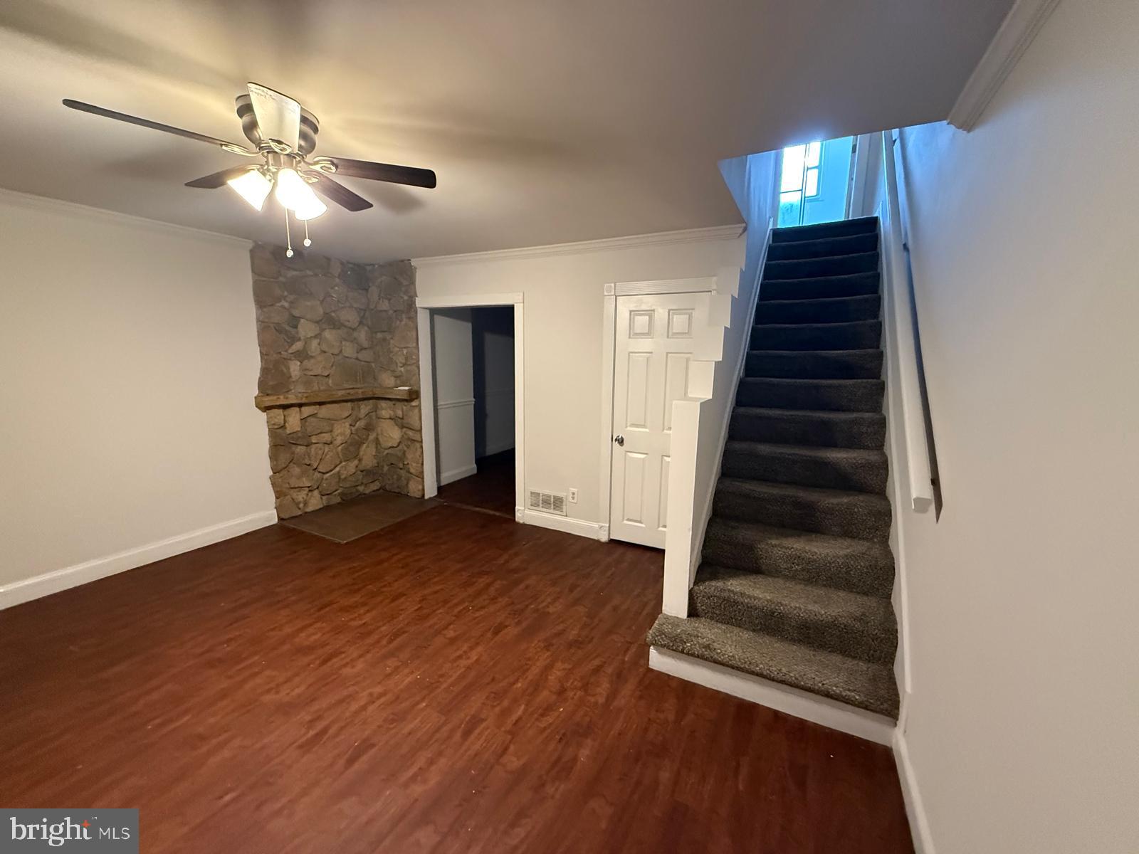 415 Grovethorn Road Baltimore, MD 21220 - Photo 6 of 16 wooden floor in an empty room with a chandelier