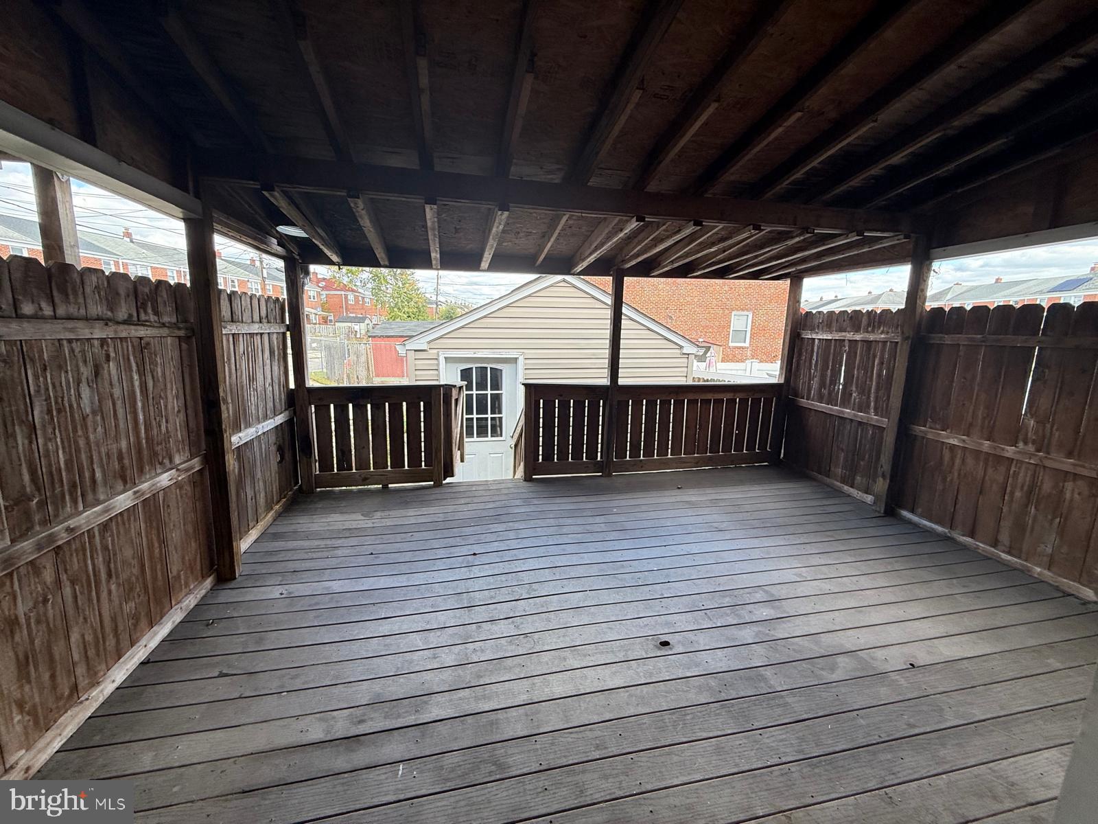 415 Grovethorn Road Baltimore, MD 21220 - Photo 10 of 16 a view of deck with wooden floor and iron stairs