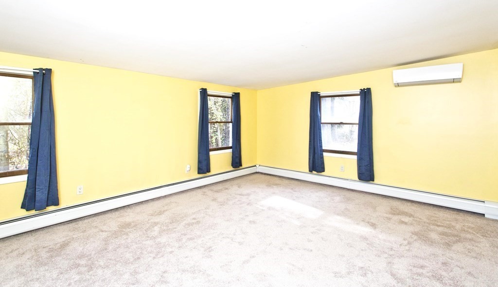 606 County Road Holyoke, MA 01040 - Photo 12 of 20 a view of an empty room with a window
