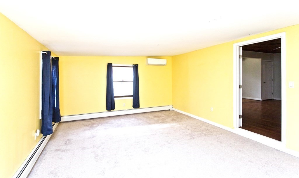 606 County Road Holyoke, MA 01040 - Photo 13 of 20 a view of an empty room with a window