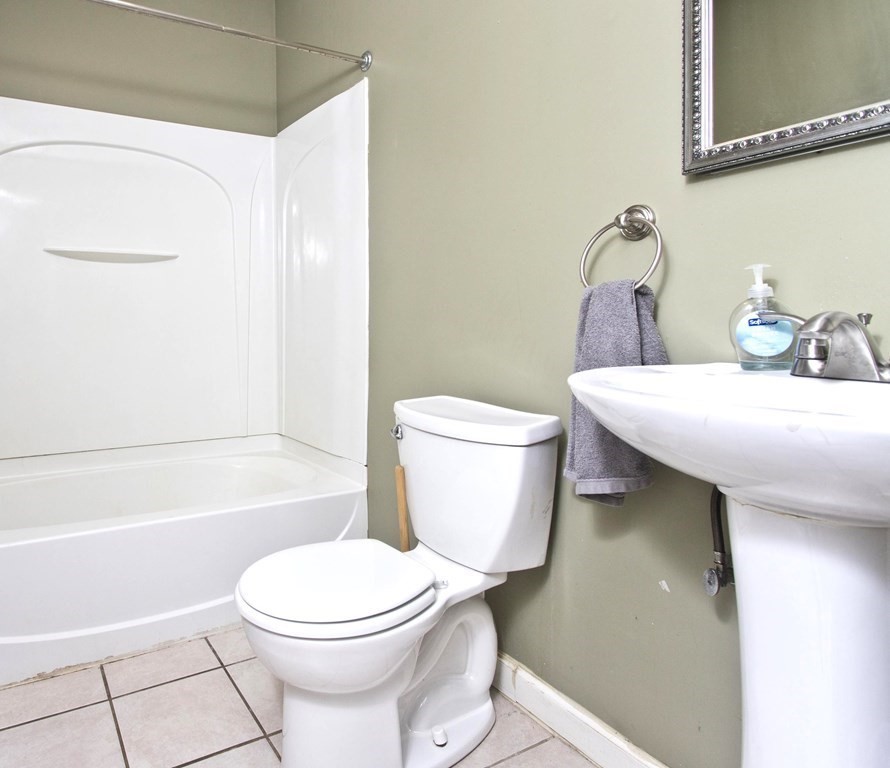 606 County Road Holyoke, MA 01040 - Photo 14 of 20 a bathroom with a toilet a sink and bathtub