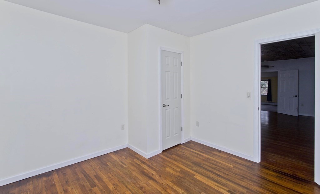 606 County Road Holyoke, MA 01040 - Photo 15 of 20 a view of an empty room with wooden floor and closet