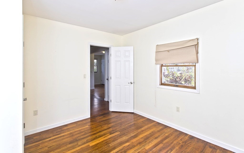 606 County Road Holyoke, MA 01040 - Photo 16 of 20 a view of an empty room with wooden floor and a window